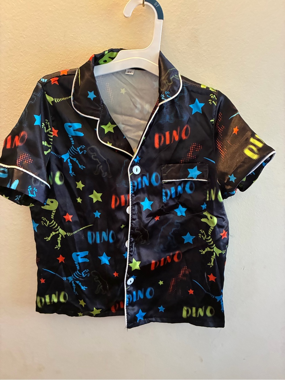 Amazon Kids Black Dino Print Pajama Top with Blue, Green, Red Stars